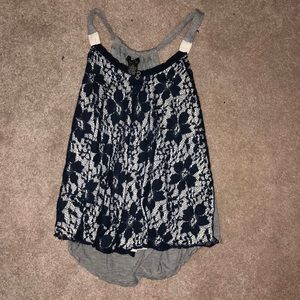 A grey and navy lace tank top